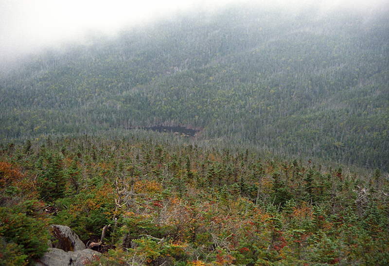 Looking down on Lake Tear of the Clouds from the summit of Skylight on a misty day